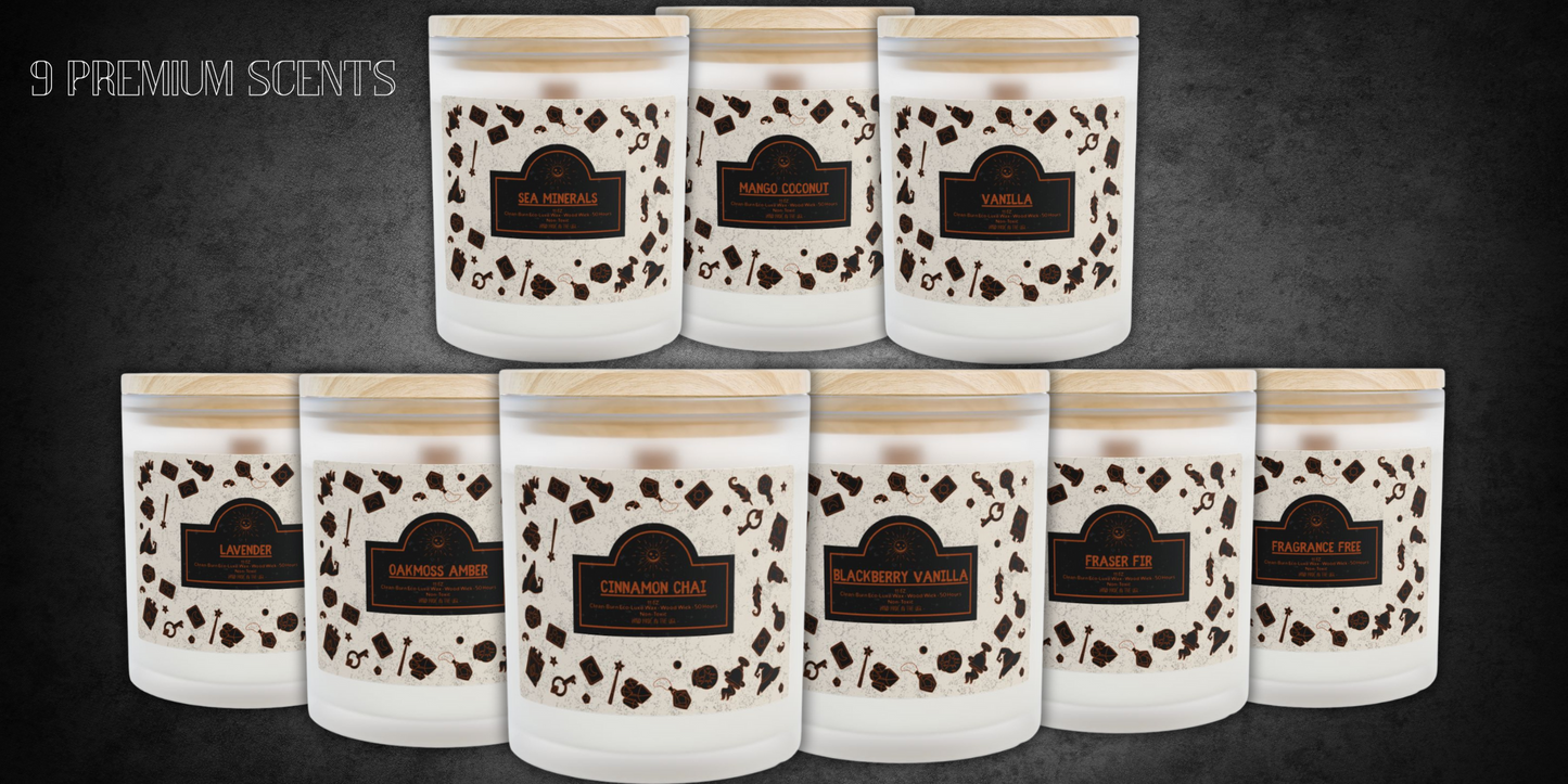 Collection of nine frosted glass wood wick candles with eco luxe clean-burn wax and wooden lids, featuring Halloween-style labels. Scents include Sea Minerals, Mango Coconut, Vanilla, Lavender, Oakmoss Amber, Cinnamon Chai, Blackberry Vanilla, Fraser Fir, and Fragrance Free.