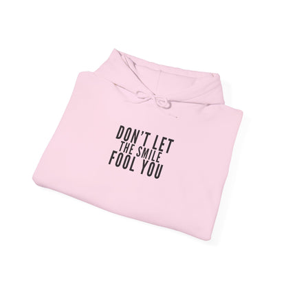 Don't Let the Smile Fool You. Gildan Unisex Hoodie