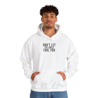 Don't Let the Smile Fool You. Gildan Unisex Hoodie