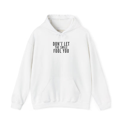 Don't Let the Smile Fool You. Gildan Unisex Hoodie