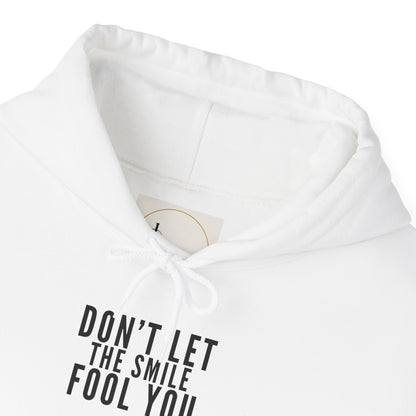 Don't Let the Smile Fool You. Gildan Unisex Hoodie
