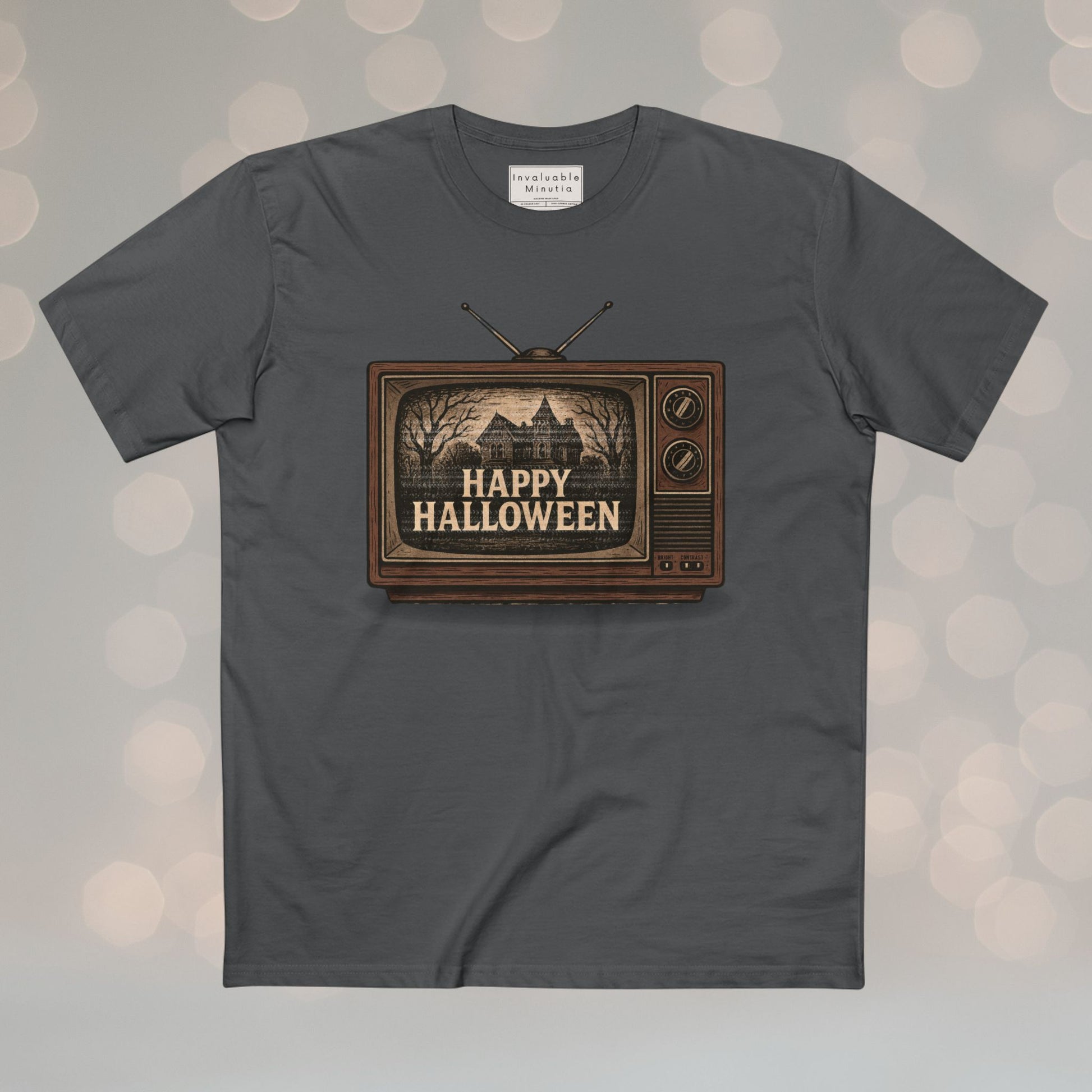 Retro TV Happy Halloween vintage unisex T-shirt with illustrated gothic horror design. Premium AS Colour tee with nostalgic Halloween vibe. Boutique spooky fashion by Invaluable Minutia.