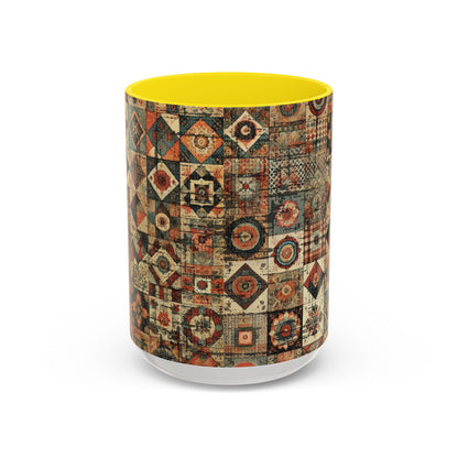 Front view of 15oz Boho Patchwork Quilt ceramic coffee mug with yellow accent handle and interior — premium white ceramic mug featuring intricate patchwork quilt-inspired geometric art design. Boutique accent mug by Invaluable Minutia. InvaluableMinutia.com