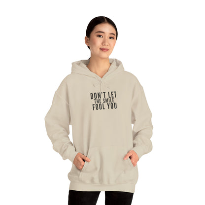 Don't Let the Smile Fool You. Gildan Unisex Hoodie