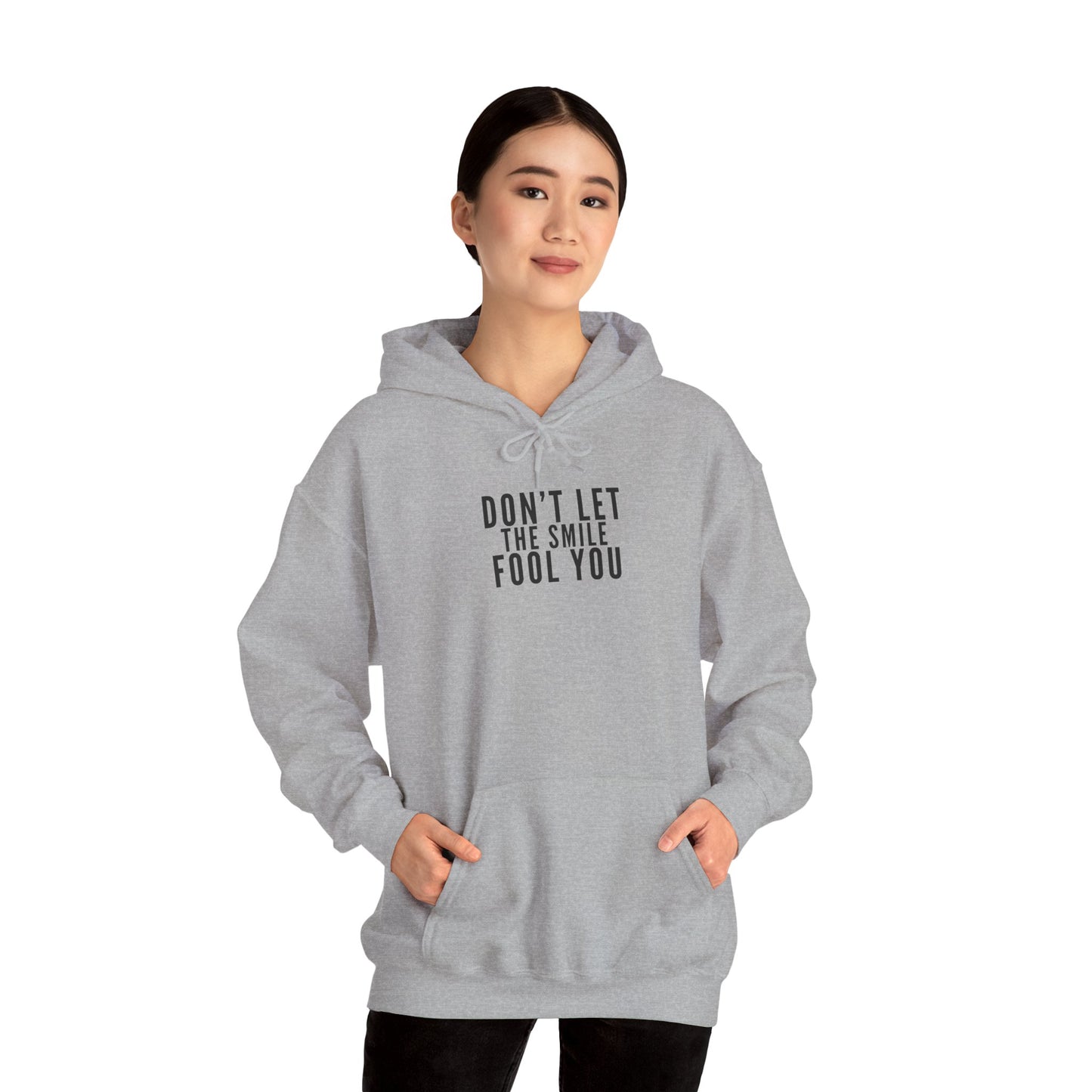 Don't Let the Smile Fool You. Gildan Unisex Hoodie