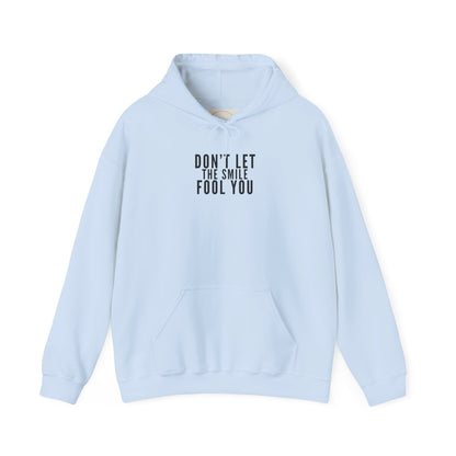 Don't Let the Smile Fool You. Gildan Unisex Hoodie