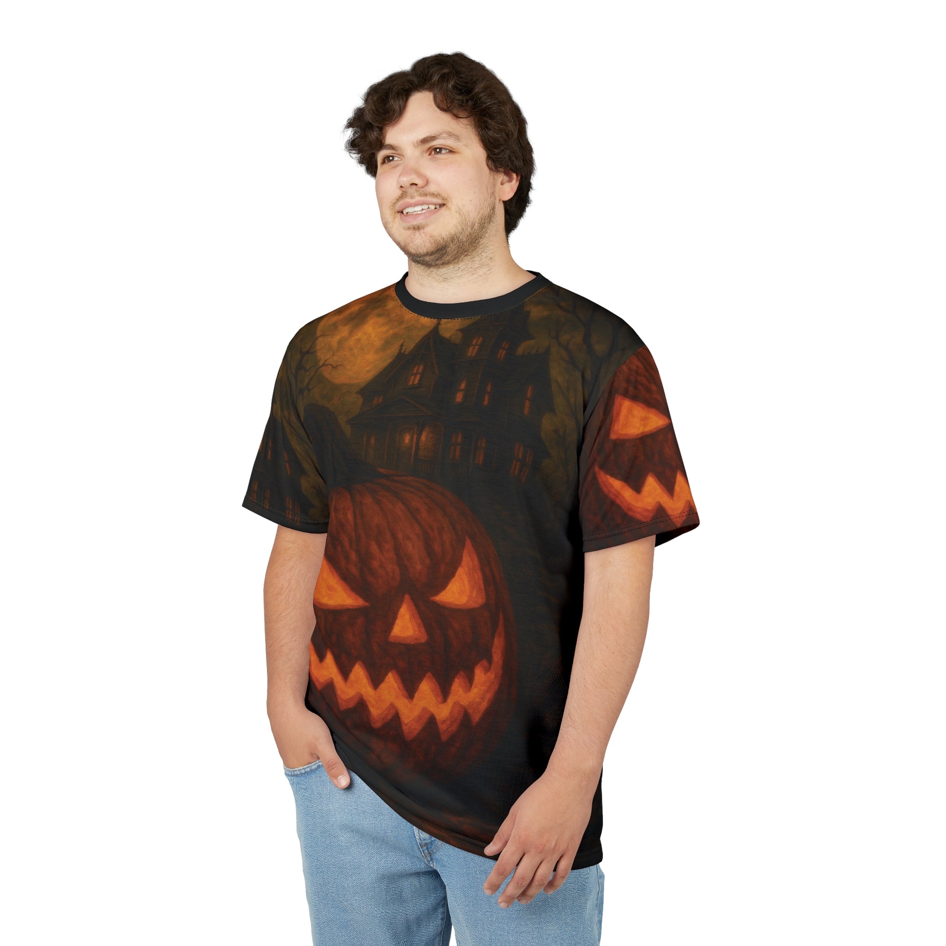 Haunted Jack-O’-Lantern gothic AOP unisex Halloween T-shirt featuring pumpkin and haunted house design with eerie fall atmosphere. Premium boutique spooky fashion by Invaluable Minutia.