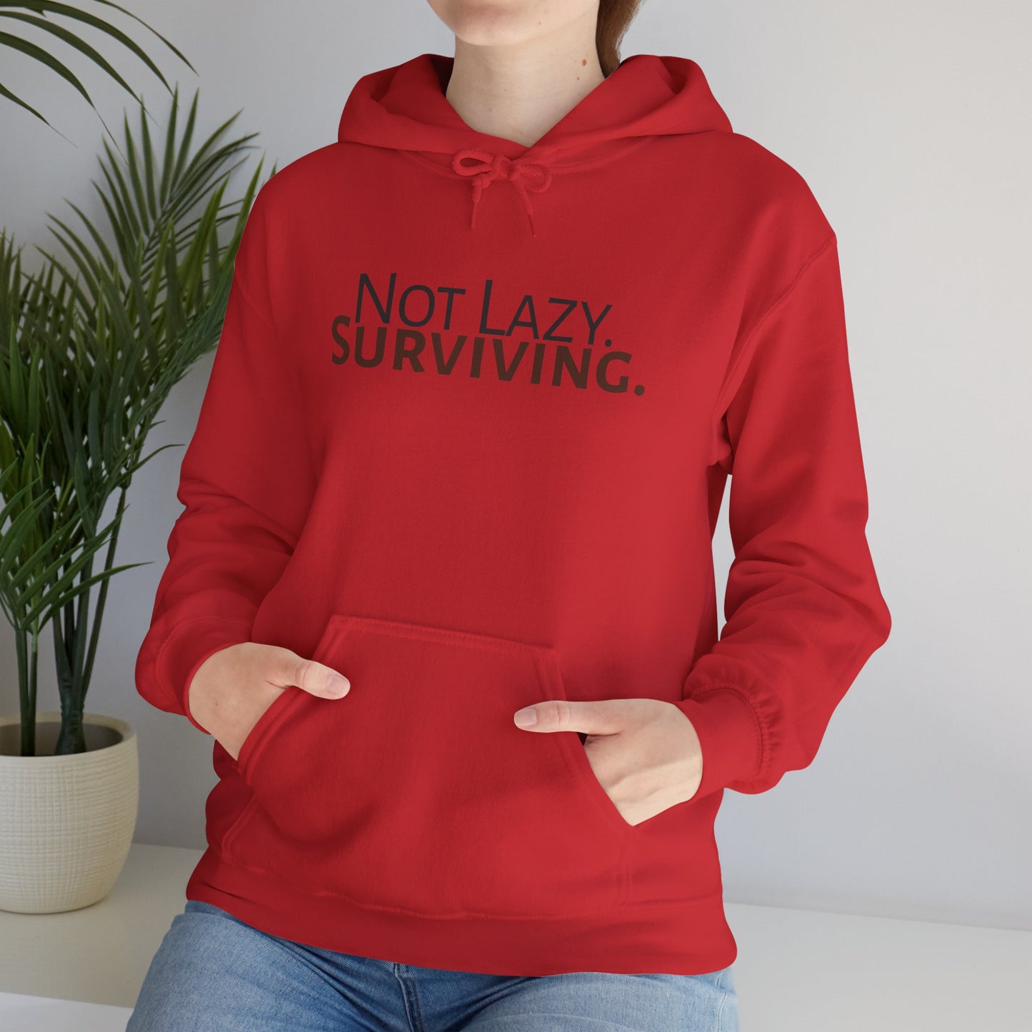 Not lazy. Surviving. Gildan Unisex Hoodie