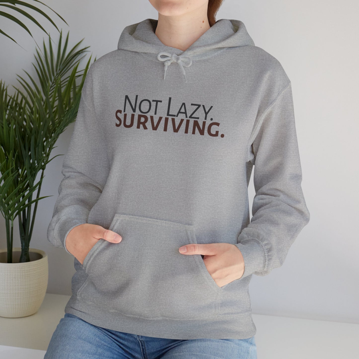 Not lazy. Surviving. Gildan Unisex Hoodie