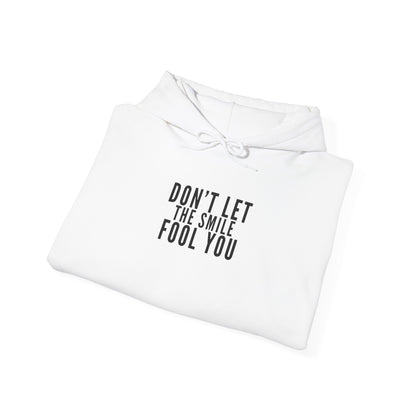 Don't Let the Smile Fool You. Gildan Unisex Hoodie