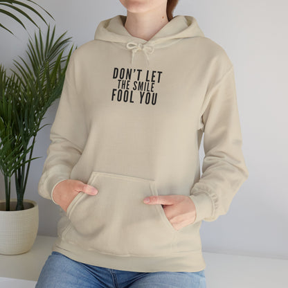 Don't Let the Smile Fool You. Gildan Unisex Hoodie