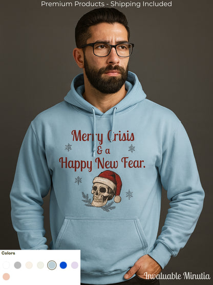 Man wearing a light blue Lane Seven hoodie featuring a gothic Christmas skull with a Santa hat and the text “Merry Crisis & a Happy New Fear,” standing against a neutral studio background.