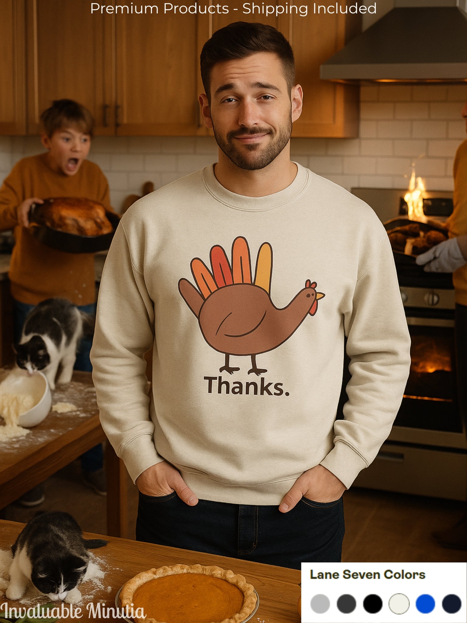 Man wearing a cream Lane Seven sweatshirt with a minimalist Thanksgiving turkey design that says “Thanks.” standing in a cozy kitchen with pie and family in the background.